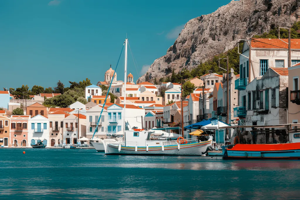 Narrow stone lane between painted houses on Kastellorizo