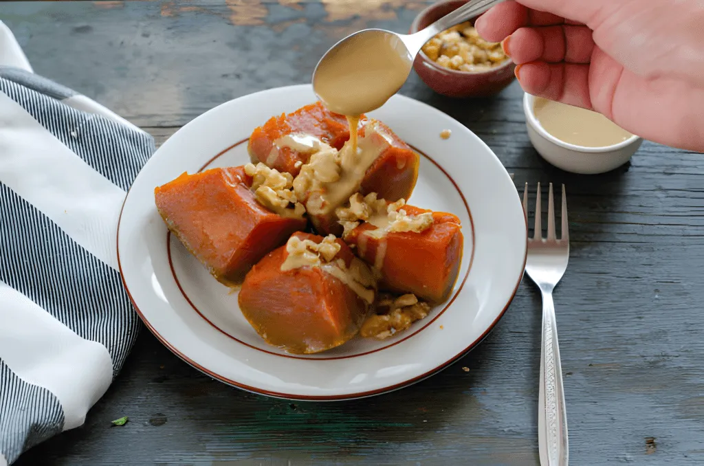Pumpkin dessert served with tahini and crushed walnuts